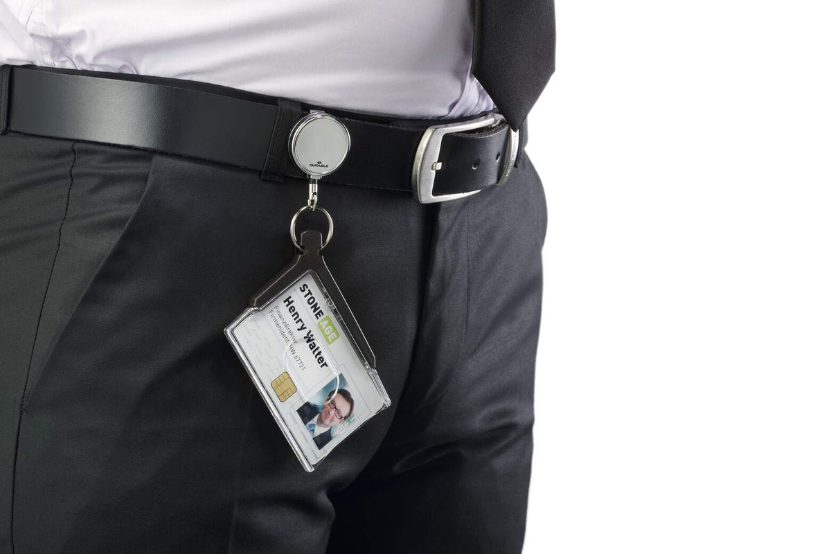 Durable Deluxe Pro card holder hanging from a chrome badge reel clipped to a belt, holding a staff photo pass